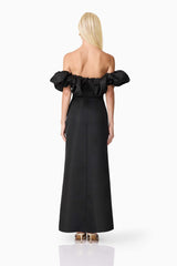 Blonde model wearing Sharon Off The Shoulder Midi Dress in Black back shot