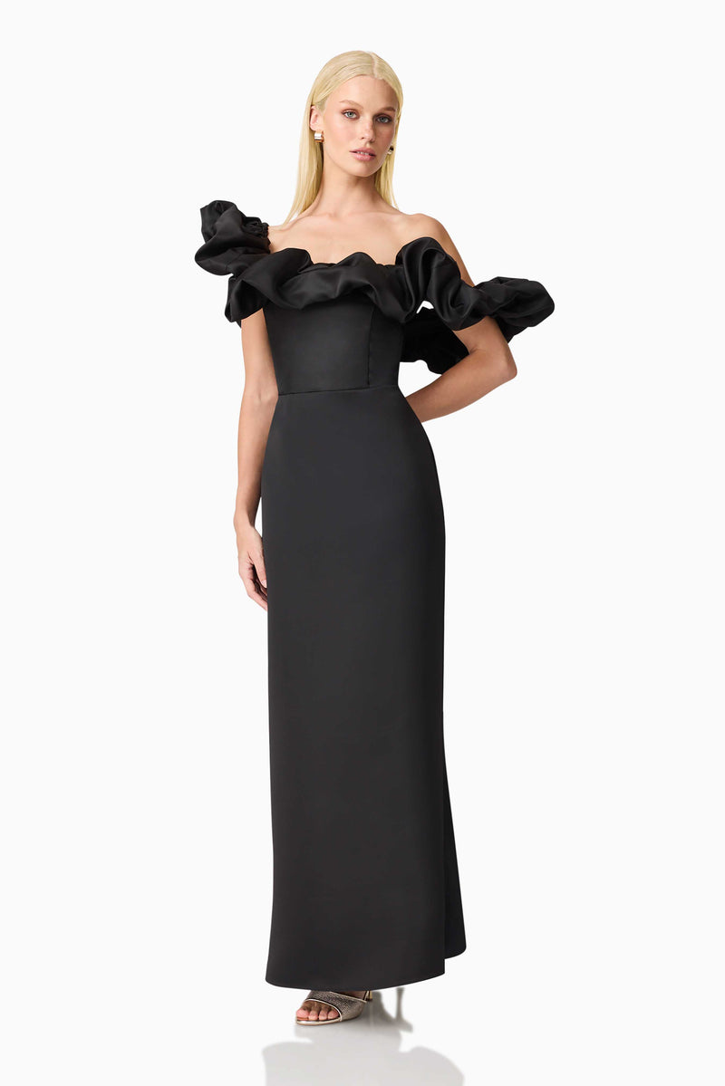 Blonde model wearing Sharon Off The Shoulder Midi Dress in Black posed hand behind hip shot