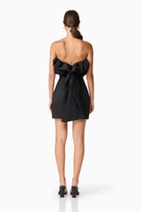 Brunette model wearing Sharon Strapless Mini Dress in Black back shot