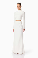 Brunette model wearing Nerissa Long Sleeve Gown in White Side Shot