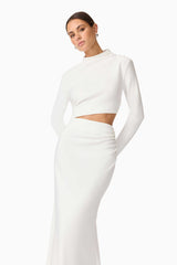 Brunette model wearing Nerissa Long Sleeve Gown in White Posed Shot