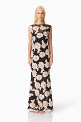 Blonde model wearing Margaus Fit & Flare Gown in Black & Gold Floral front shot
