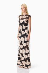 Blonde model wearing Margaus Fit & Flare Gown in Black & Gold Floral side shot