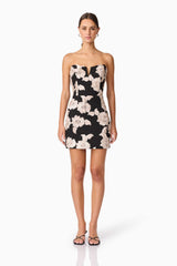 Brunette model wearing Margaux Strapless Mini Dress in Black & Gold Floral  front shot