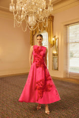 Model wears the Florentia Textured Jacquard Maxi Dress in Pink and Red as a wedding guest