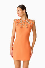 Solae Floral Mini Dress in Orange with metal flower trim close up shot