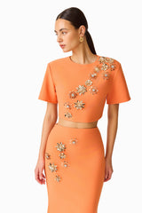 Solae Floral Top & Skirt Set in Orange with metal flower trim top detail shot
