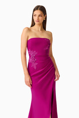 Dahlira Asymmetrical Gown in Orchid Pink with strapless neckline and slit close up shot