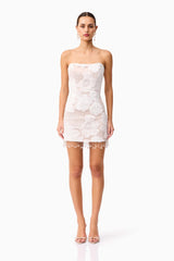 Brunette model wearing the Roxana Strapless Mini Dress in White front shot 