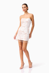 Brunette model wearing the Roxana Strapless Mini Dress in White posed shot 