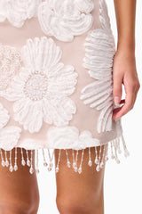 Brunette model wearing the Roxana Strapless Mini Dress in White detail shot 
