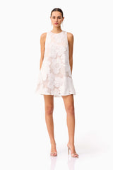 Brunette model wearing the Roxana Shift Mini Dress in White posed shot