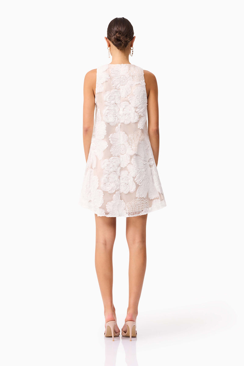 Brunette model wearing the Roxana Shift Mini Dress in White back shot