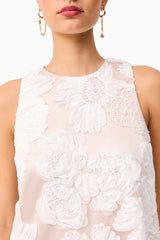 Brunette model wearing the Roxana Shift Mini Dress in White detail shot