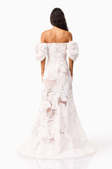 Brunette model wearing the Roxana Off The Shoulder Gown in White back shot 