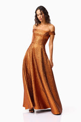 Brunette model wearing the Sapphira Off The Shoulder Gown in Orange posed shot 