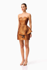 Brunette model wearing the Sapphira Strapless Mini Dress in Orange side shot
