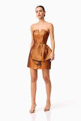 Brunette model wearing the Sapphira Strapless Mini Dress in Orange posed shot