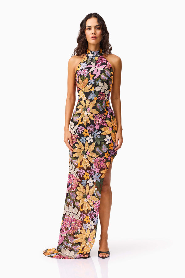 Brunette model wearing the Kiran Halter Gown in Orange Floral front shot 