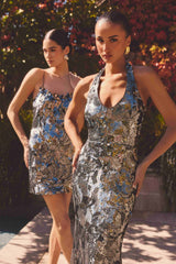 Model is wearing the Titania Halter Gown in Deep Silver to a gala night