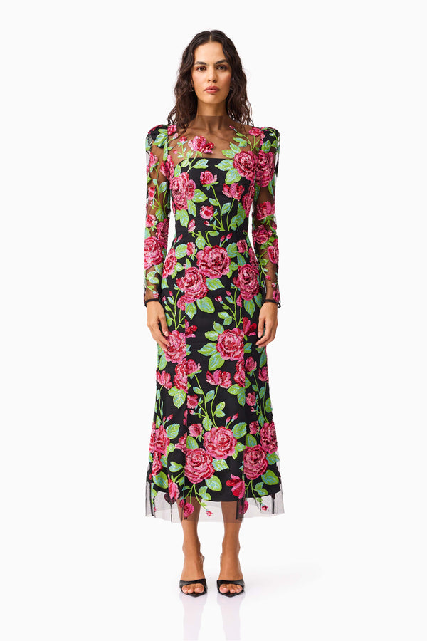 Brunette model wearing the Lyra Sequin Long Sleeve Midi Dress in Pink & Green Floral front shot
