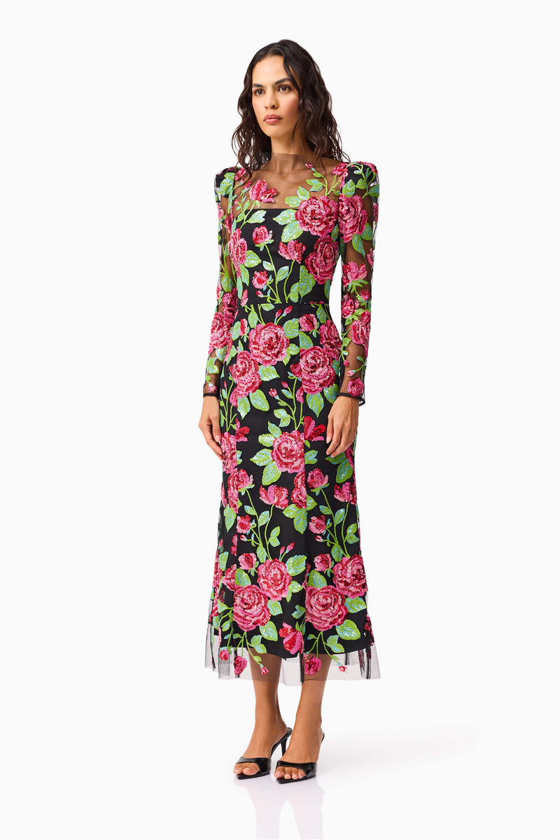 Brunette model wearing the Lyra Sequin Long Sleeve Midi Dress in Pink & Green Floral side shot