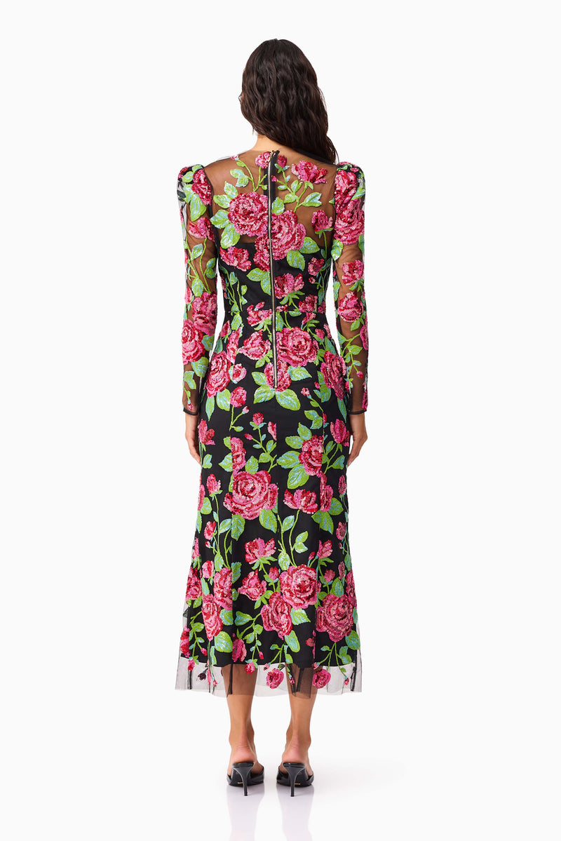 Brunette model wearing the Lyra Sequin Long Sleeve Midi Dress in Pink & Green Floral back shot