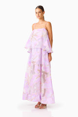 Brunette model wearing the Elysia Tiered Gown in Purple Floral side shot