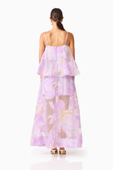 Brunette model wearing the Elysia Tiered Gown in Purple Floral back shot