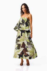Brunette model wearing the Elysia Tiered Gown in Black & Green Floral posed shot