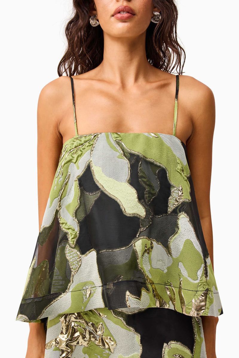 Brunette model wearing the Elysia Tiered Gown in Black & Green Floral detail shot