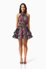 Brunette Model wearing the Estelle Halter Mini Dress in Black & Pink Floral front shot