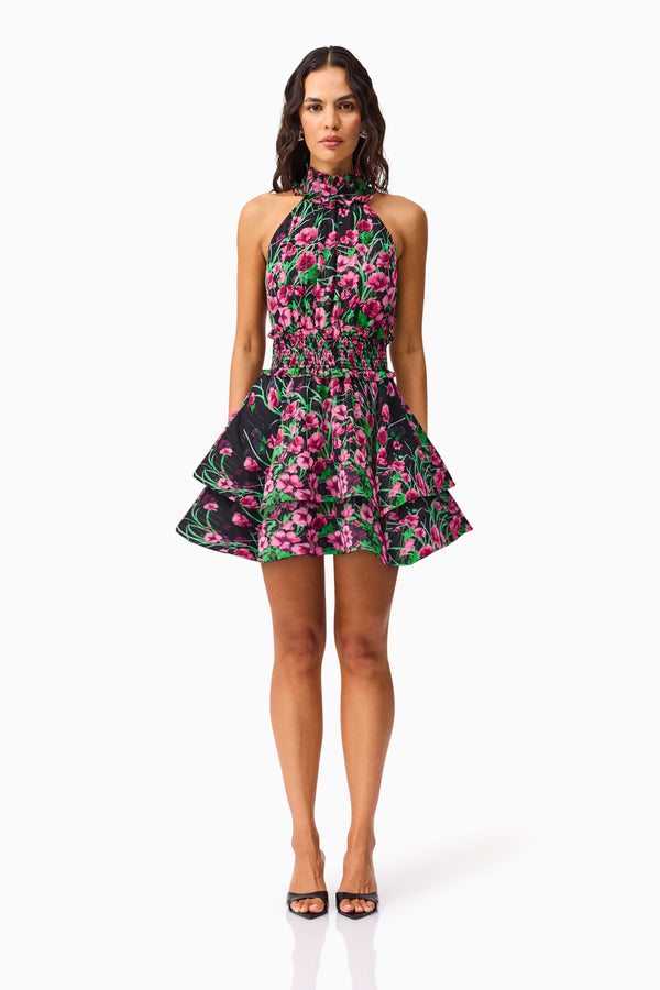 Brunette Model wearing the Estelle Halter Mini Dress in Black & Pink Floral front shot