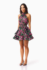 Brunette Model wearing the Estelle Halter Mini Dress in Black & Pink Floral side shot