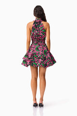 Brunette Model wearing the Estelle Halter Mini Dress in Black & Pink Floral back shot