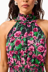 Brunette Model wearing the Estelle Halter Mini Dress in Black & Pink Floral detail shot