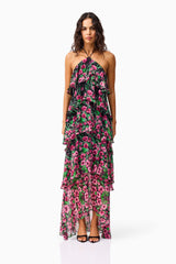 Brunette model wearing the Estelle Halter Gown in Black & Pink Floral front shot