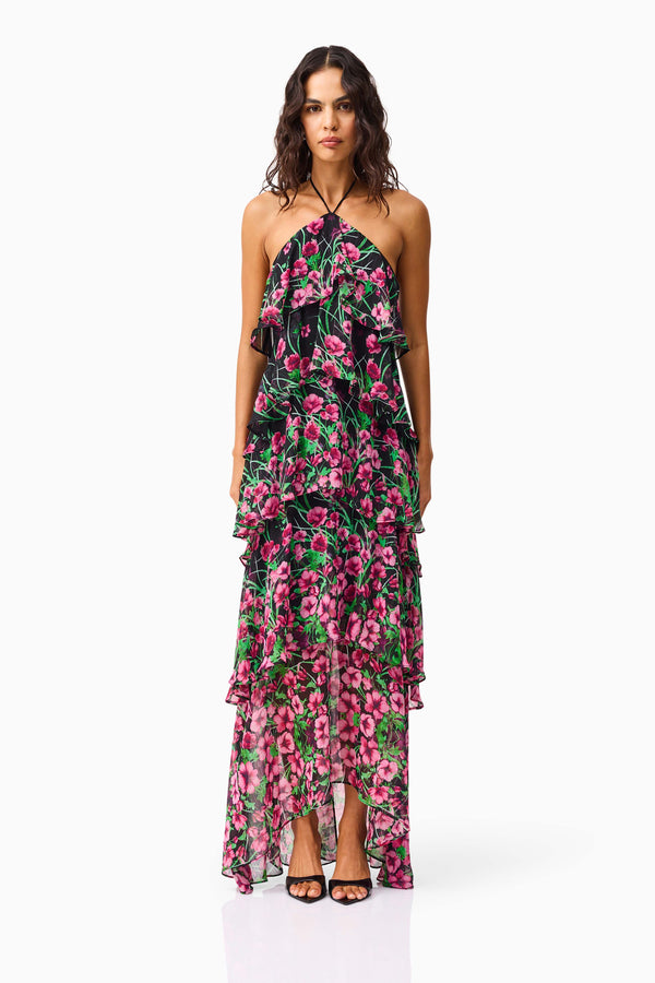 Brunette model wearing the Estelle Halter Gown in Black & Pink Floral front shot