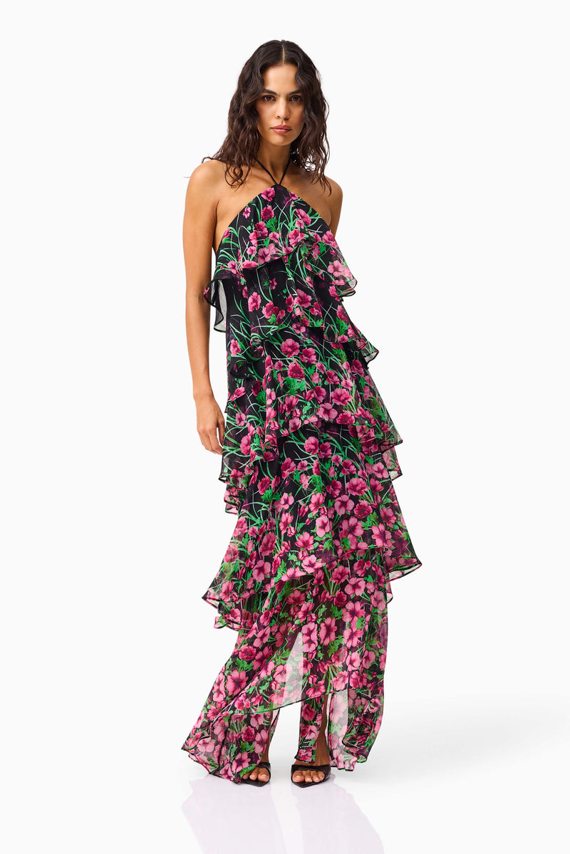 Brunette model wearing the Estelle Halter Gown in Black & Pink Floral posed shot