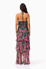 Brunette model wearing the Estelle Halter Gown in Black & Pink Floral back shot