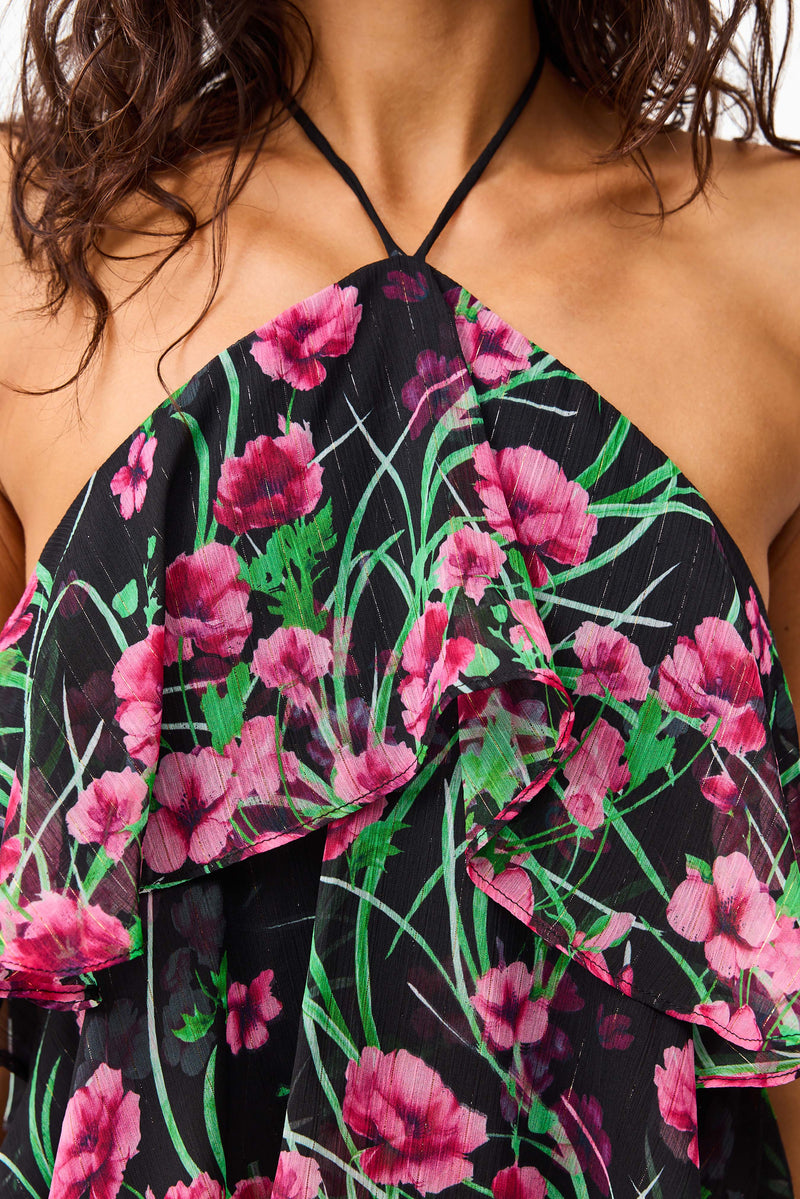 Brunette model wearing the Estelle Halter Gown in Black & Pink Floral detail shot