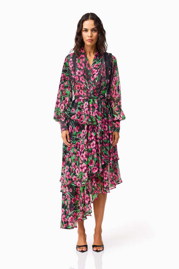 Brunette model wearing the Estelle Halter Mini Dress in Black & Pink Floral front shot