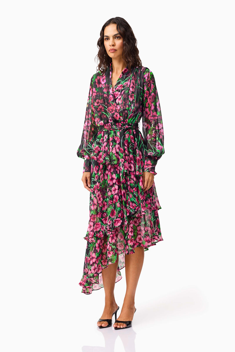 Brunette model wearing the Estelle Halter Mini Dress in Black & Pink Floral side shot
