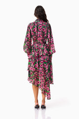 Brunette model wearing the Estelle Halter Mini Dress in Black & Pink Floral back shot