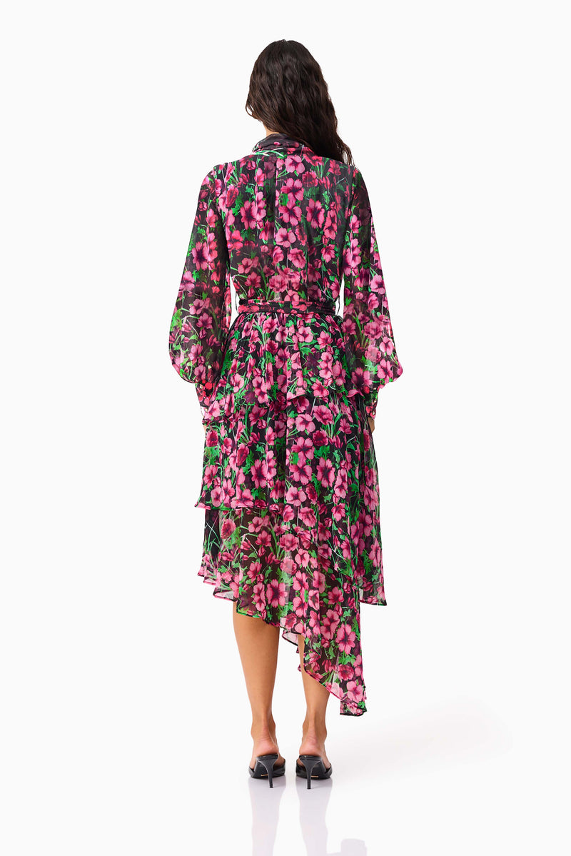 Brunette model wearing the Estelle Halter Mini Dress in Black & Pink Floral back shot