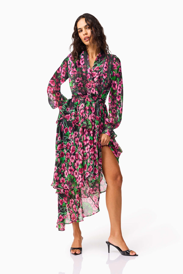 Brunette model wearing the Estelle Halter Mini Dress in Black & Pink Floral posed shot