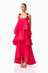 Brunette model wearing the Thalia Tiered Gown in Pink side shot