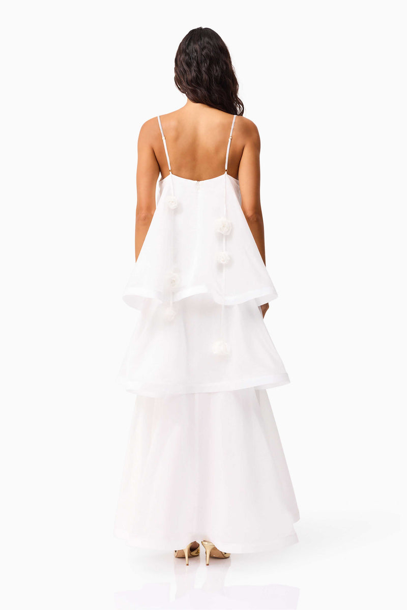 Brunette model wearing the Thalia Tiered Gown in White back shot 