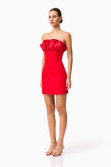 Brunette model wearing the Yasmine Strapless Mini Dress in Red side shot 