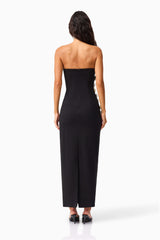 Brunette model wearing the Yasmine Strapless Maxi Dress in Black back shot 